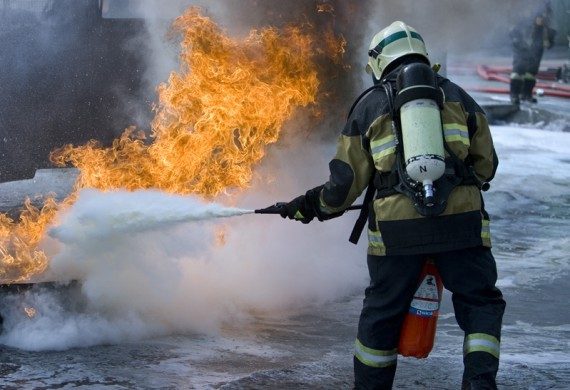 Firefighter exstinguishing a fire